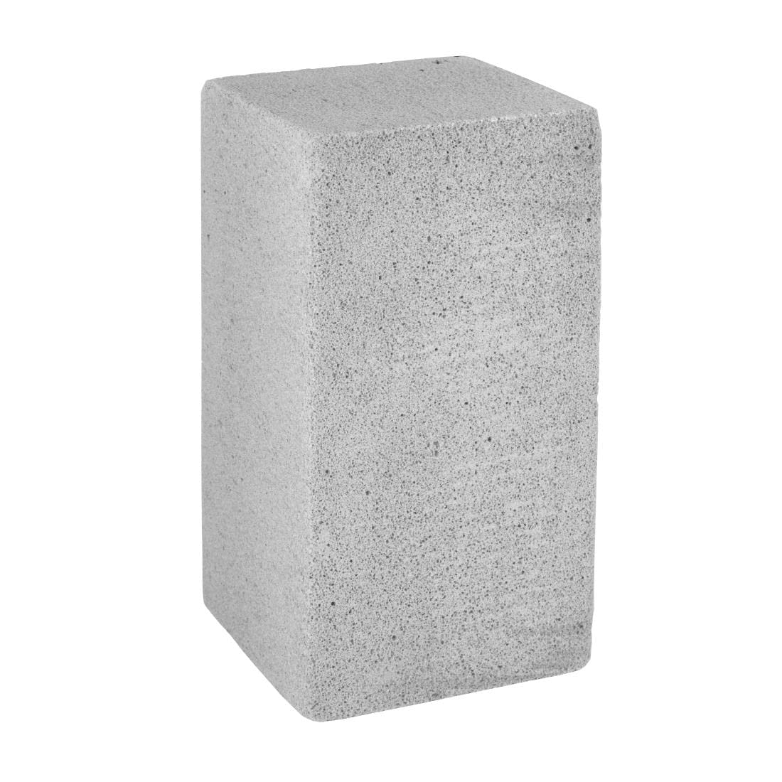 Jantex L402 pumice block cleaning a hot steel griddle to remove burnt-on grease