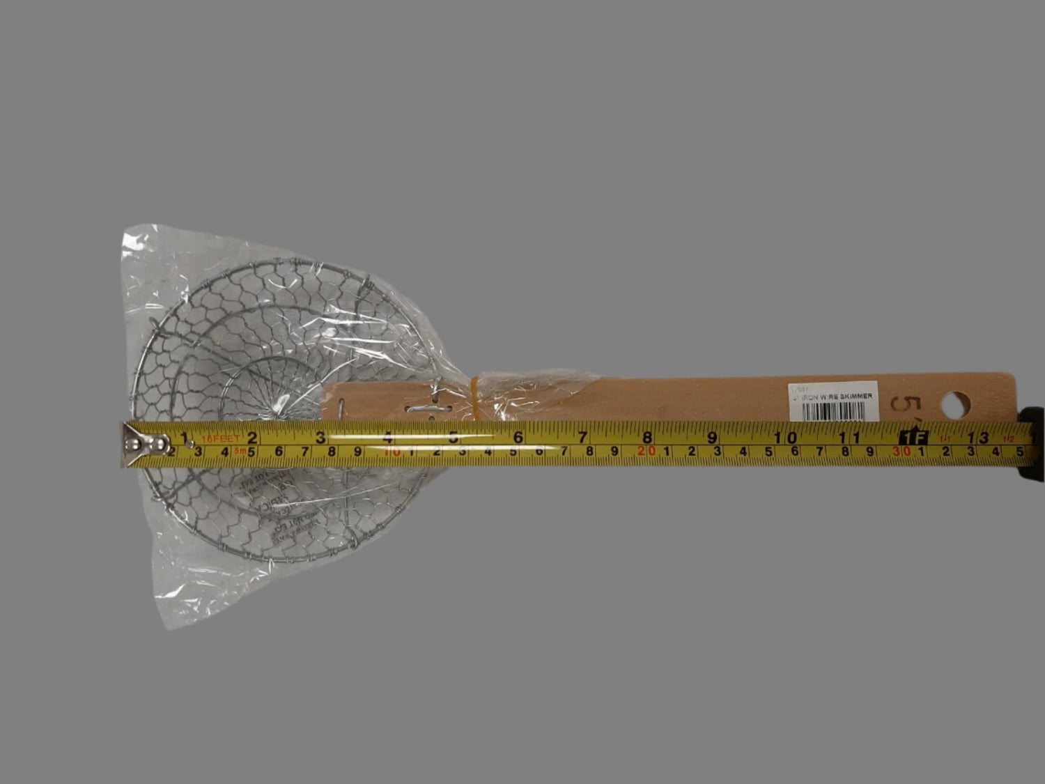 Angled view of London Wok D6S5 5-inch wire skimmer showing rigid stainless basket and reinforced frame