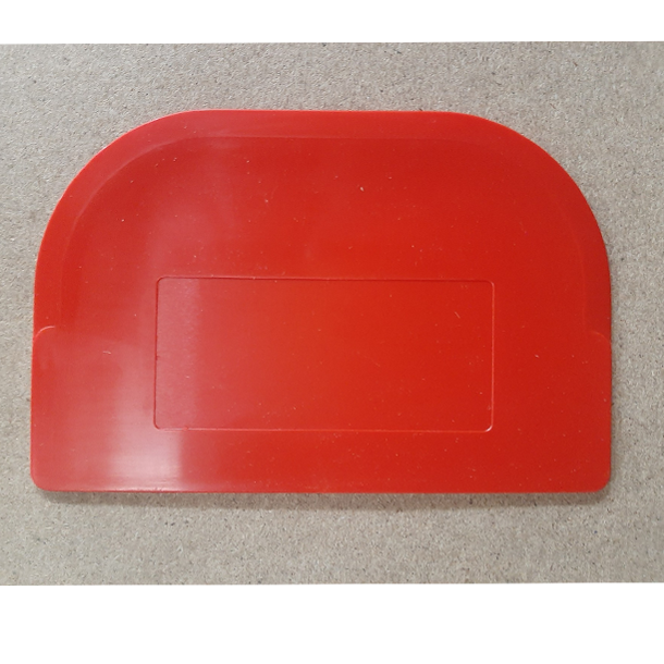Large plastic bowl scraper (105 × 160 mm) showing curved and straight edges